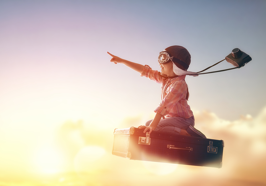 boy flying on a magic briefcase. 