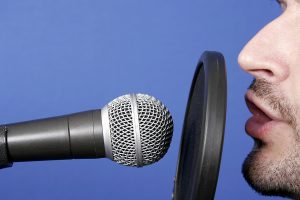 announcer with microphone and pop screen.